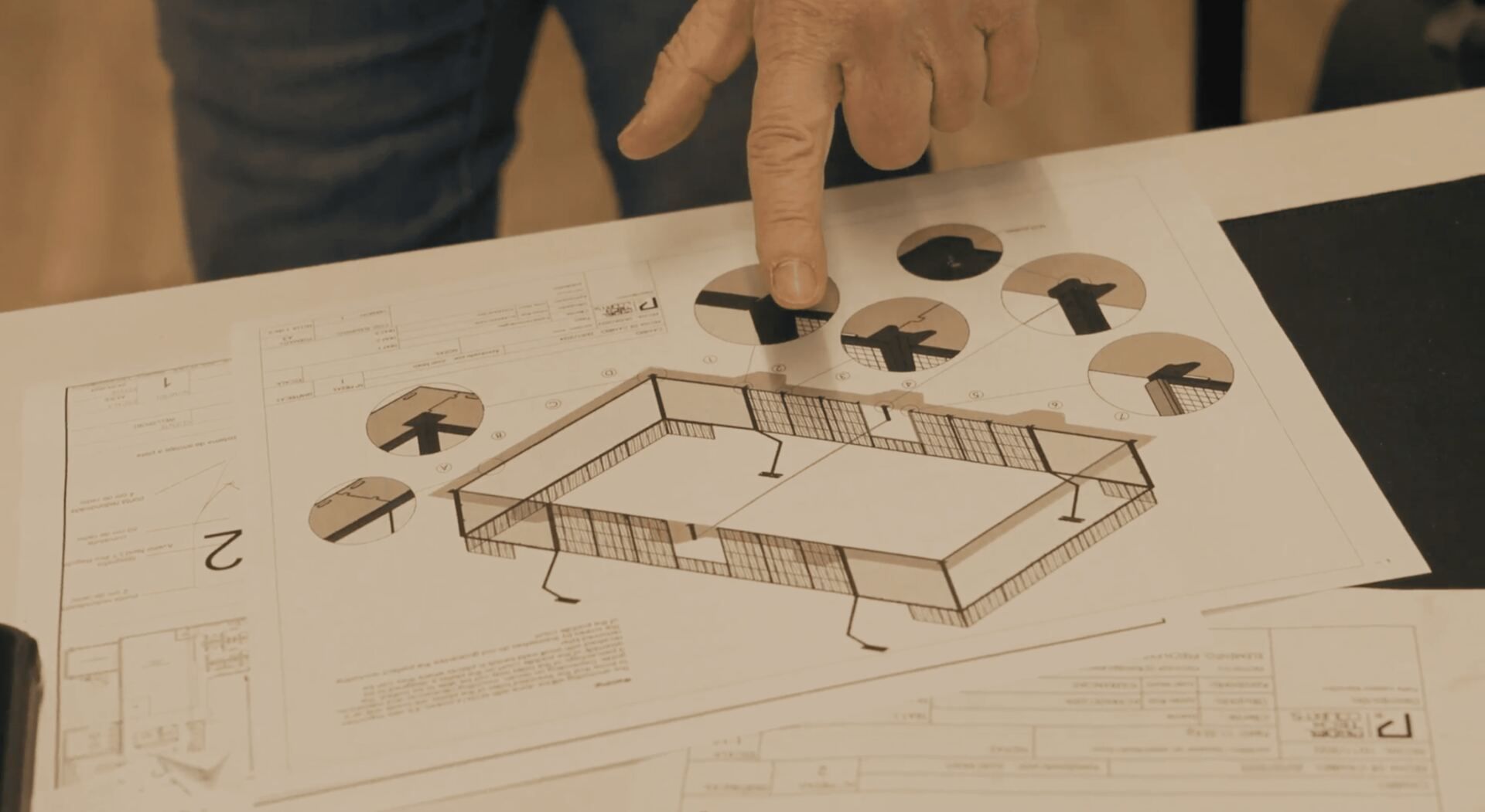 Padel Tech specialists reviewing technical drawings and design details for a padel court.